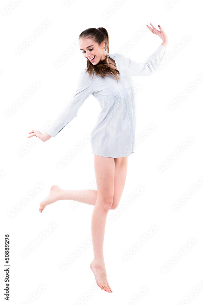 Beautiful girl with long legs jumping Isolated on white Beautiful girl with long legs jumping Isolated on white
