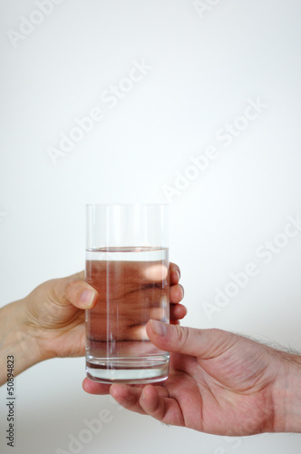woman hand with glass of water
