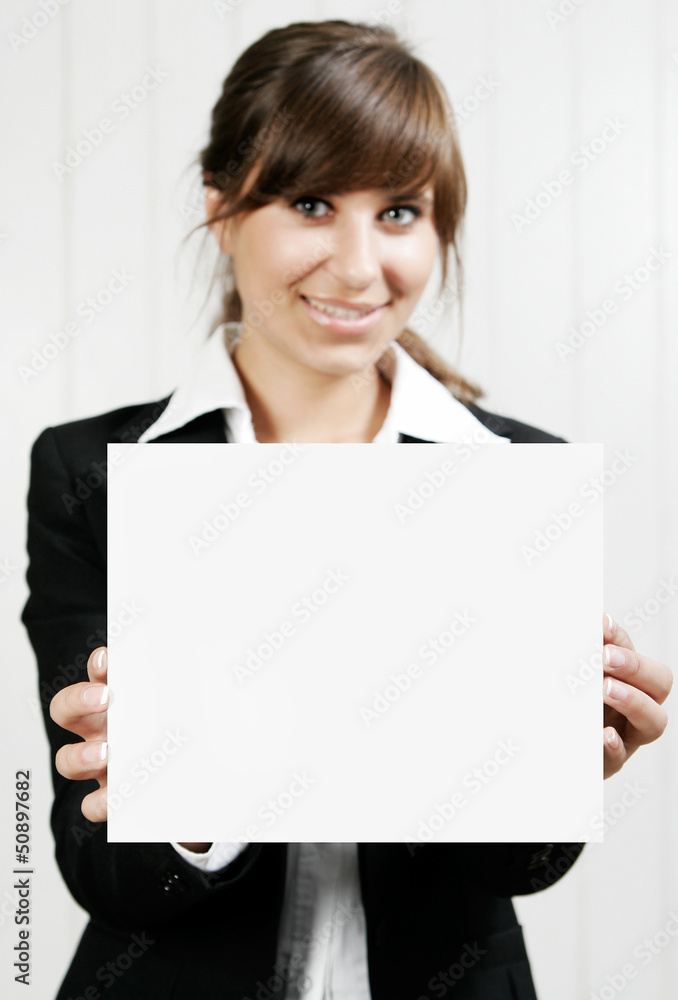 Smiling woman holding an empty card Smiling woman holding an empty card