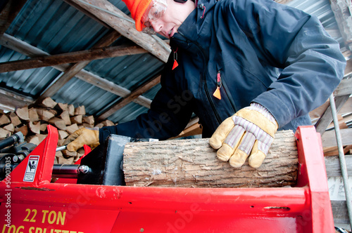 Splitting wood in the woodshed