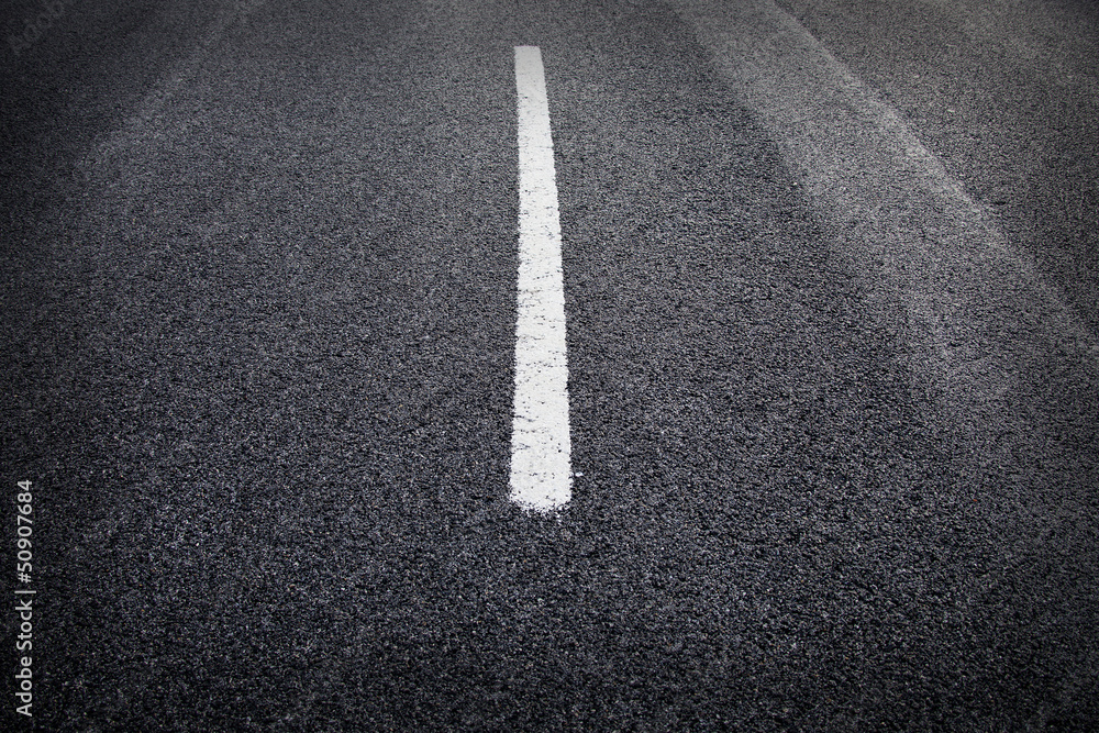 Fototapeta premium Asphalt road texture with yellow stripe