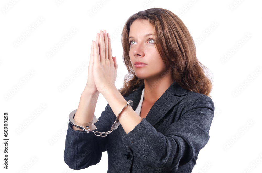 Female businesswoman with handcuffs on white Female businesswoman with handcuffs on white
