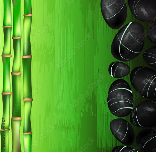 background of a spa with stones and green bamboo