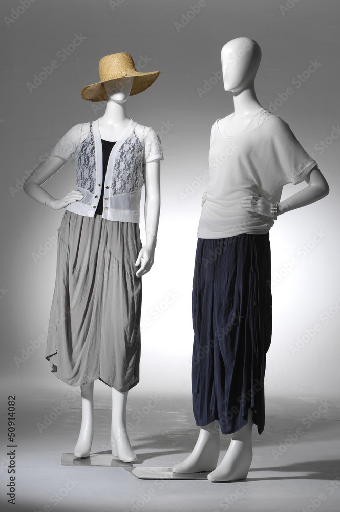 Two Fashion female clothing in hat on mannequin Two Fashion female clothing in hat on mannequin