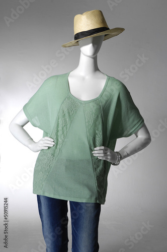 female clothing in jeans with hat on mannequin photo