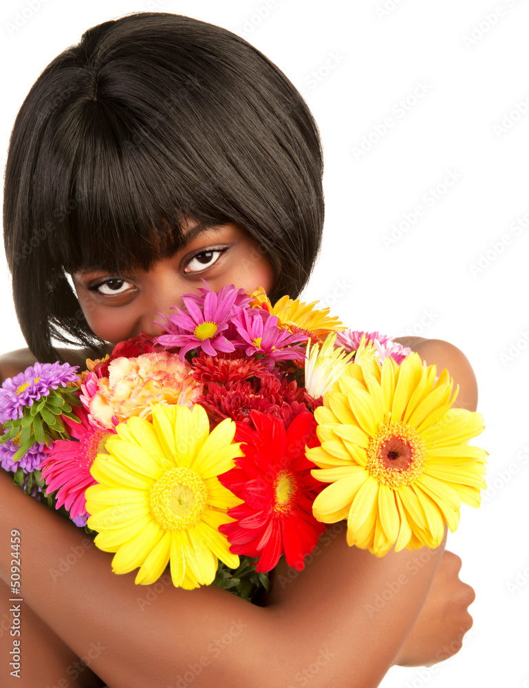 Black female smelling flowers