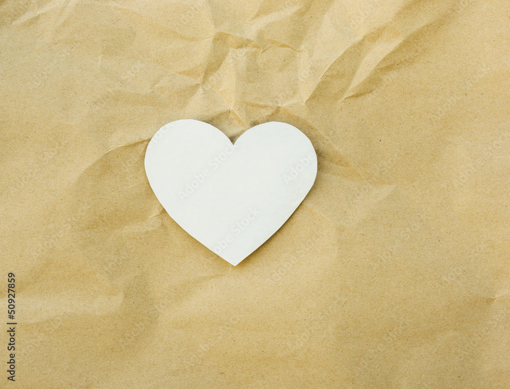 Fototapeta premium Heart paper on brown paper texture