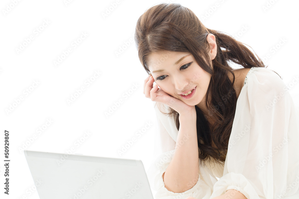 Beautiful young woman using a laptop computer Beautiful young woman using a laptop computer