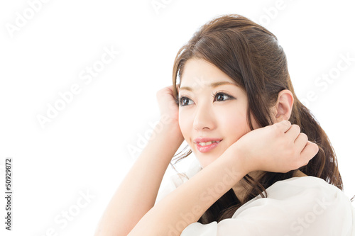 Beautiful asian woman relaxing on white background