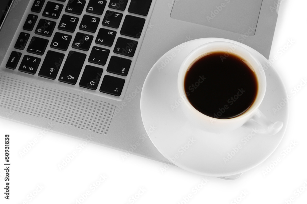 White laptop with cup of coffee close-up isolated on white White laptop with cup of coffee close-up isolated on white