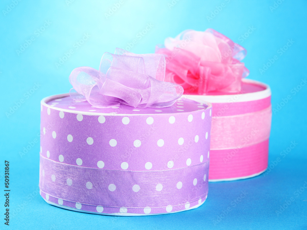 Bright gifts with bows on blue background Bright gifts with bows on blue background