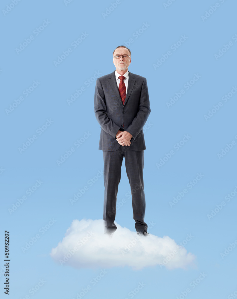 Senior business man standing on a cloud Senior business man standing on a cloud