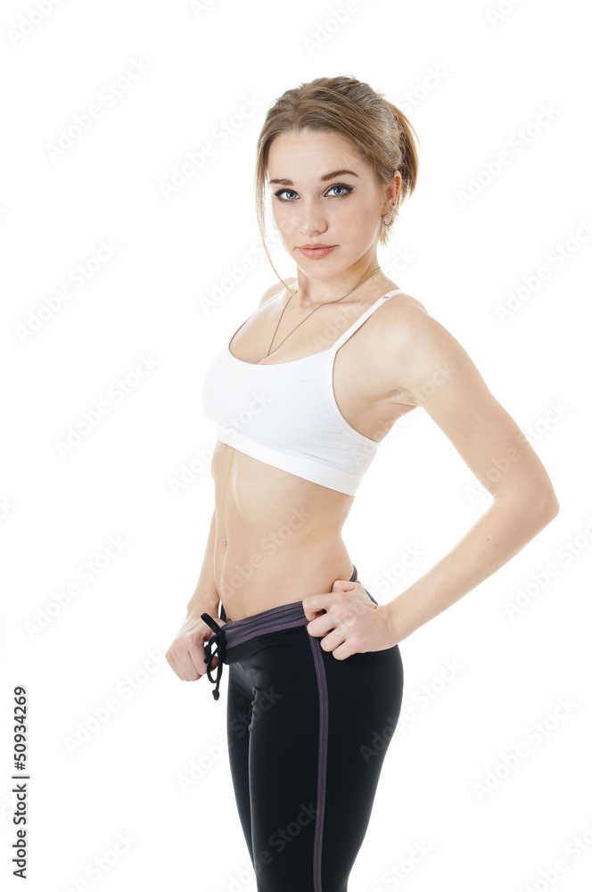 Beautiful athletic girl in white - black sportive clothes. Beautiful athletic girl in white - black sportive clothes.