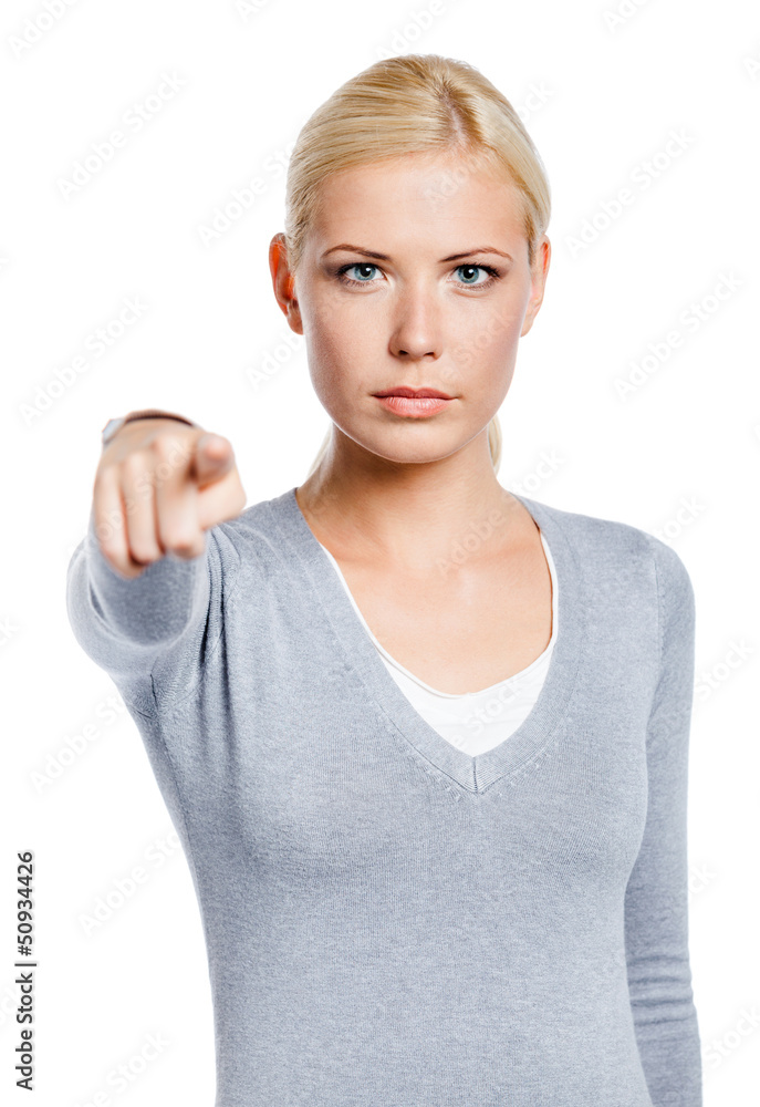 Woman pointing at someone with forefinger, isolated on white Woman pointing at someone with forefinger, isolated on white