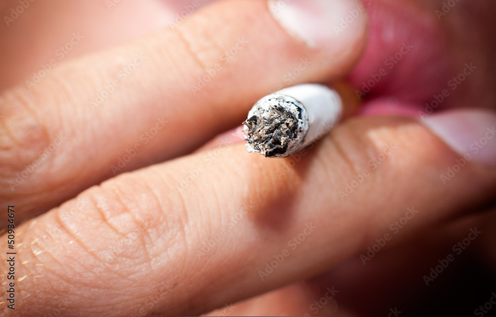 Man smokes a cigarette. macro Man smokes a cigarette. macro