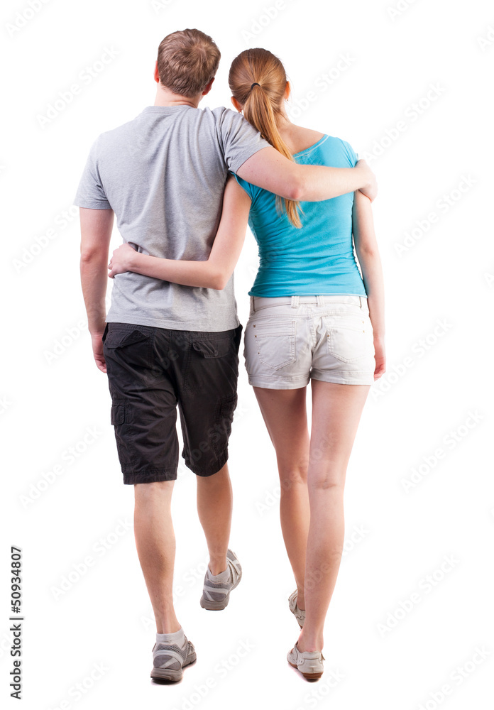 Back view of going young couple Back view of going young couple