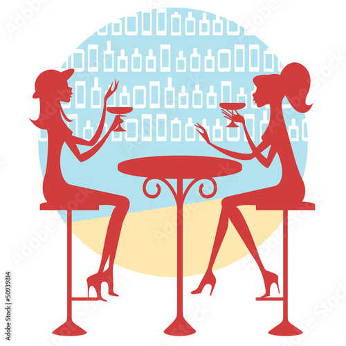 Dos amigas tomando una copa y charlando