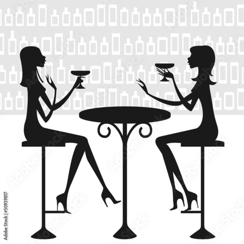 Dos amigas tomando una copa y charlando