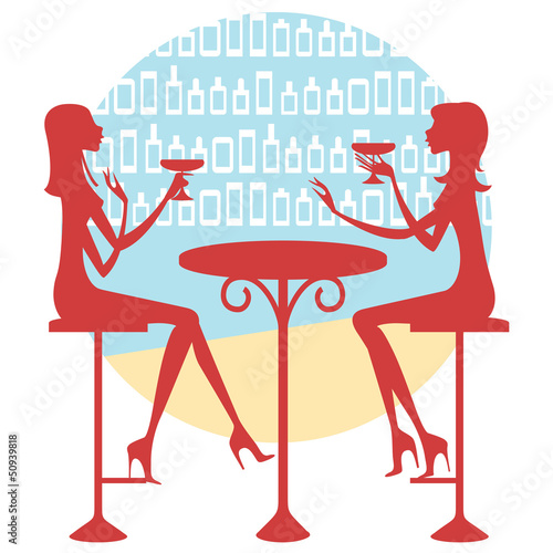 Dos amigas tomando una copa y charlando