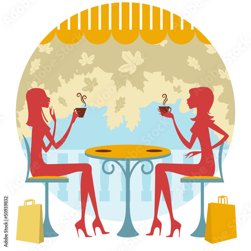 Dos amigas tomando un café o té y charlando