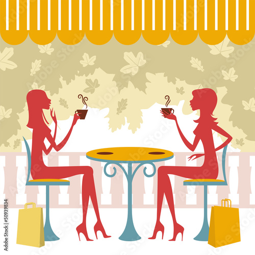 Dos amigas tomando un café o té y charlando