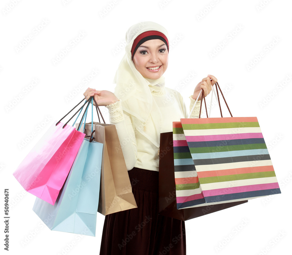 young muslim woman with shopping bag