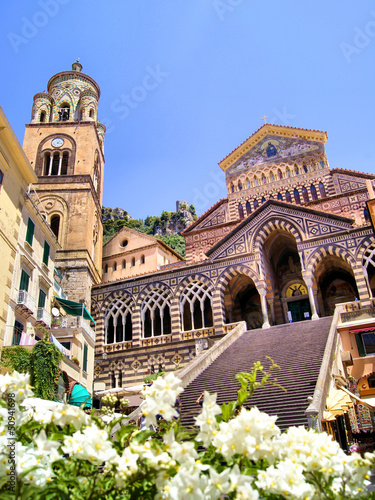 Ornate Amalfi Cathedral with flowers, Italy