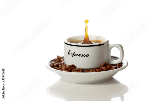 a cup of coffee with a splash