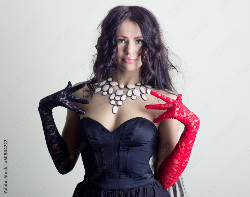 Beautiful young lady with a luxurious necklace around her neck. Beautiful young lady with a luxurious necklace around her neck.