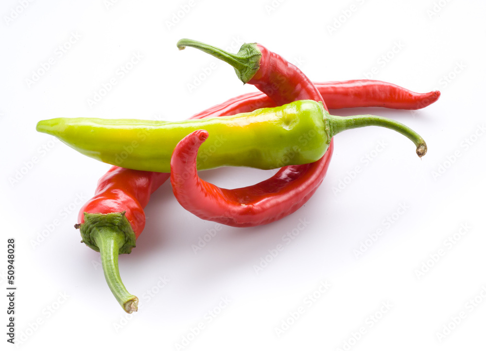 Red and green hot chili peppers isolated on a white background Red and green hot chili peppers isolated on a white background