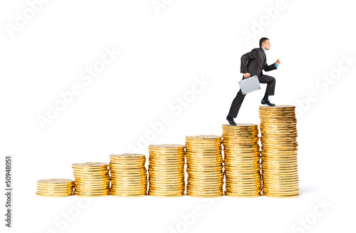 Businessman goes up the gold coins