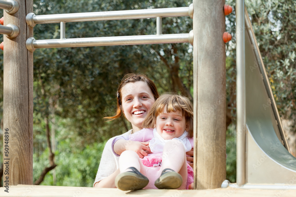 Obraz premium happy mother with child at playground