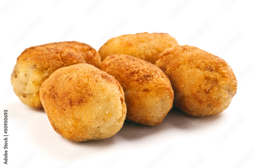 group filled with gold croquettes on white base