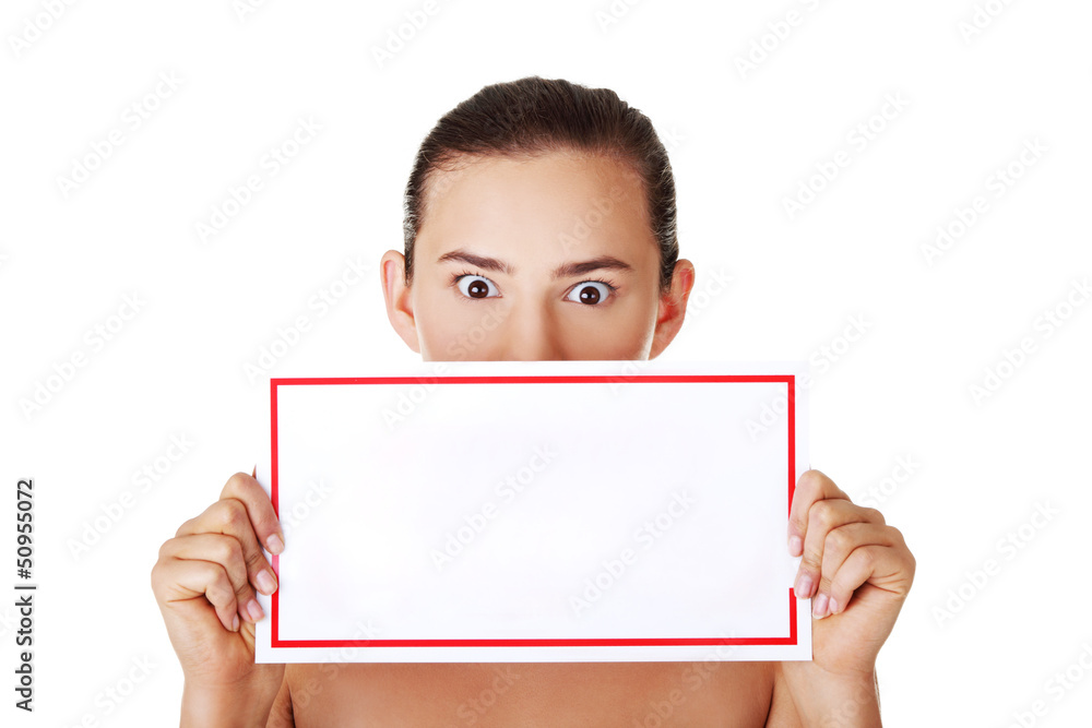Shocked woman holding blank board Shocked woman holding blank board