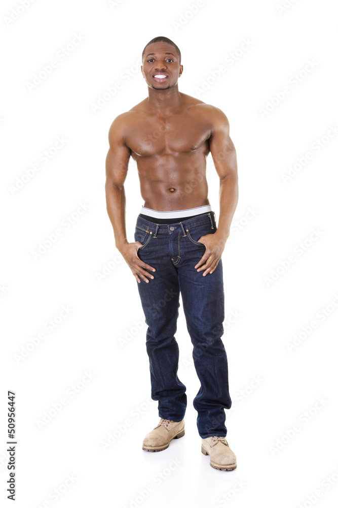 Happy well-built muscular black man in jeans