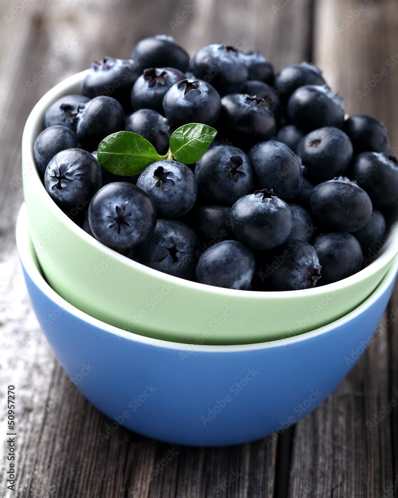 Fresh ripe blueberries in the colored plates Fresh ripe blueberries in the colored plates