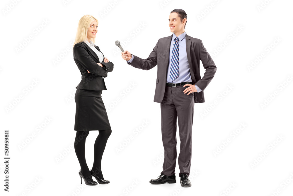 Full length portrait of a businesswoman and male reporter having Full length portrait of a businesswoman and male reporter having