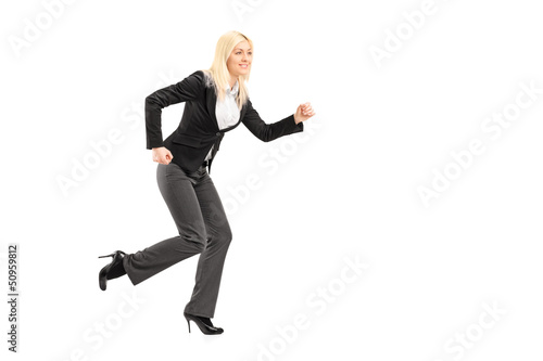 Full length portrait of a businesswoman running