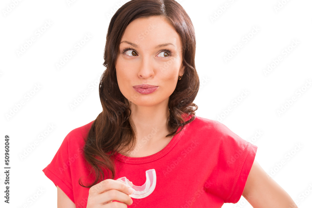 Closeup portrait of charming woman wearing orthodontic braces ho Closeup portrait of charming woman wearing orthodontic braces ho