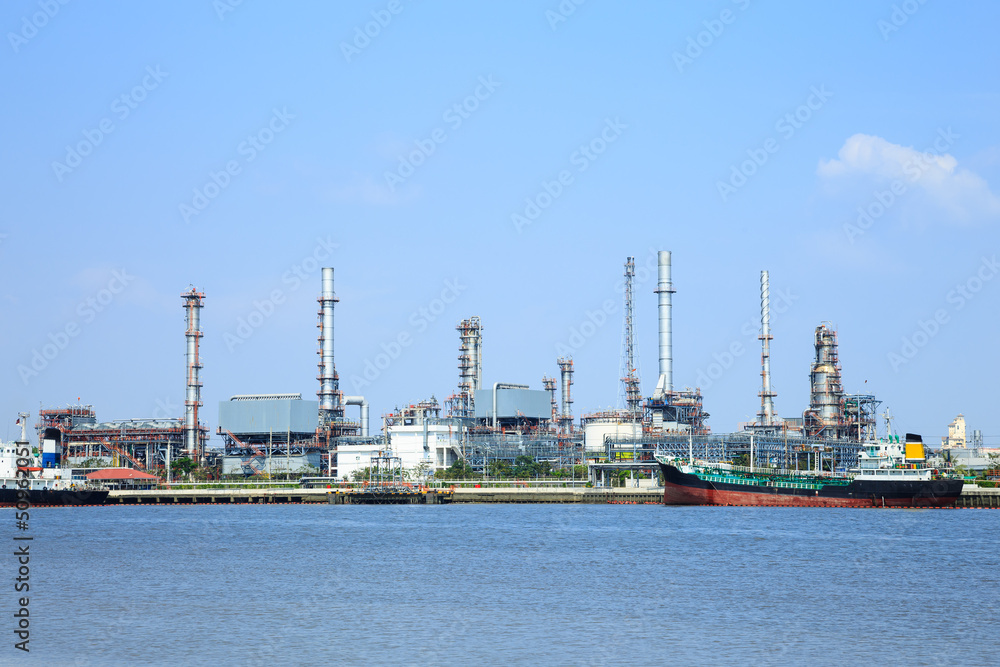 Oil refinery with blue sky on water front