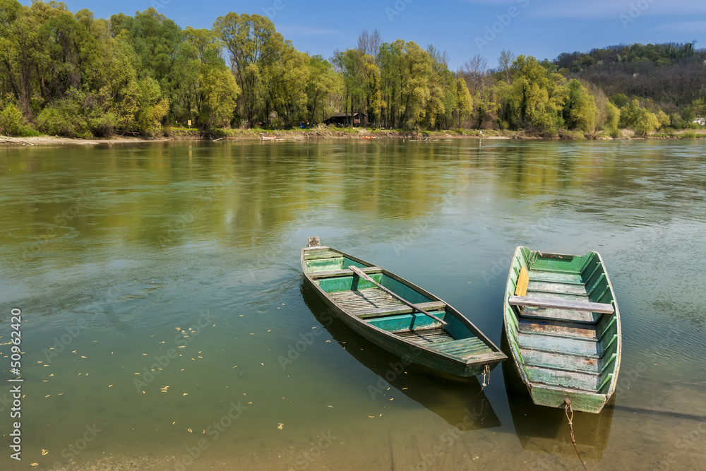 Two green boats in the river