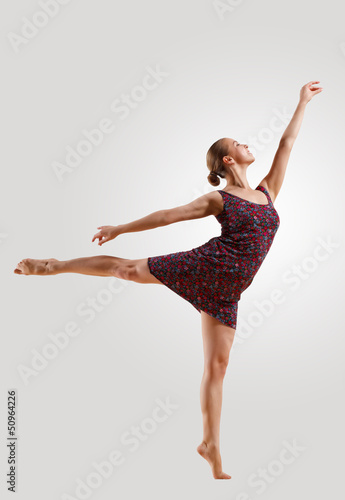 Fototapeta Naklejka Na Ścianę i Meble -  Girl in color dress dancing