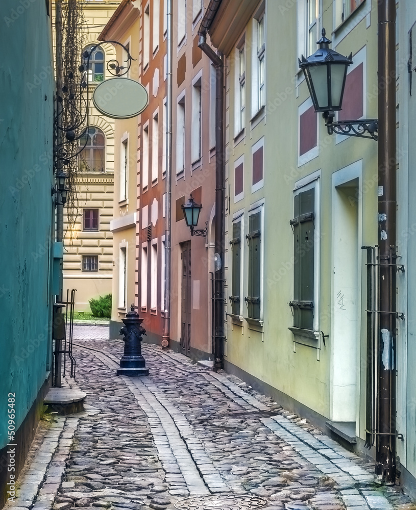 Narrow mrdieval street in old Riga, Latvia, Europe