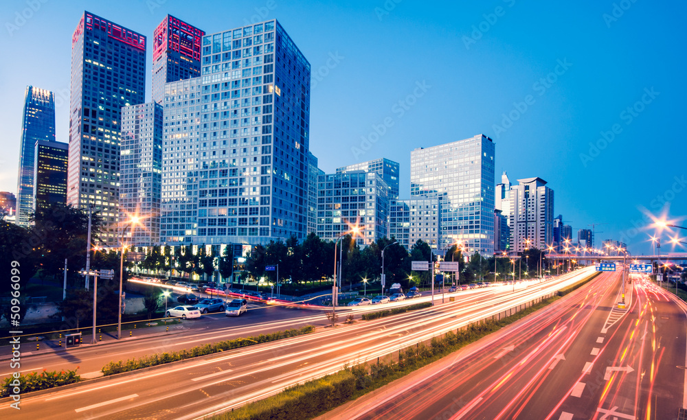 light trails on the modern city at dusk in beijing,China