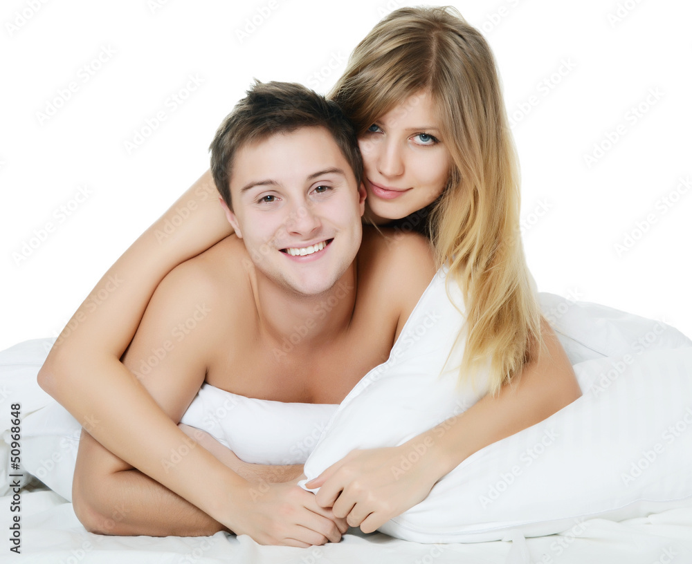 Beautiful pair lays in a bed Beautiful pair lays in a bed