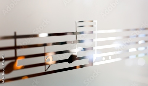 Musical notes on frosted glass, art background photo