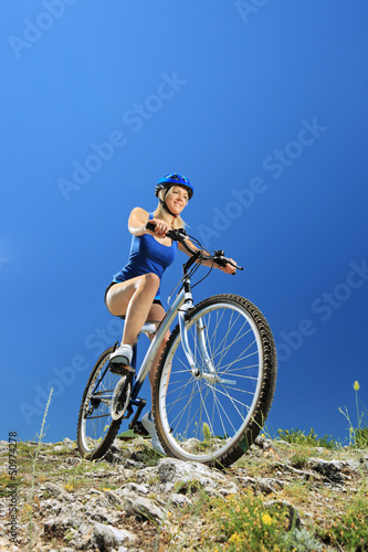 Female biker riding a mountain bike