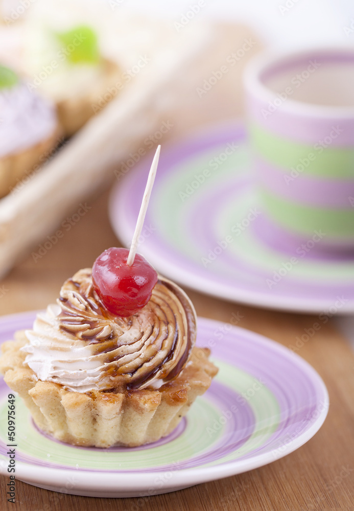 Delicious cream pastry on a plate, ready to eat Delicious cream pastry on a plate, ready to eat