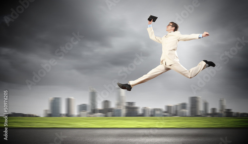 Image of running businessman © Sergey Nivens