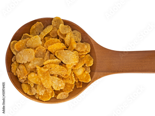 Spoonful of cornflakes isolated over white background